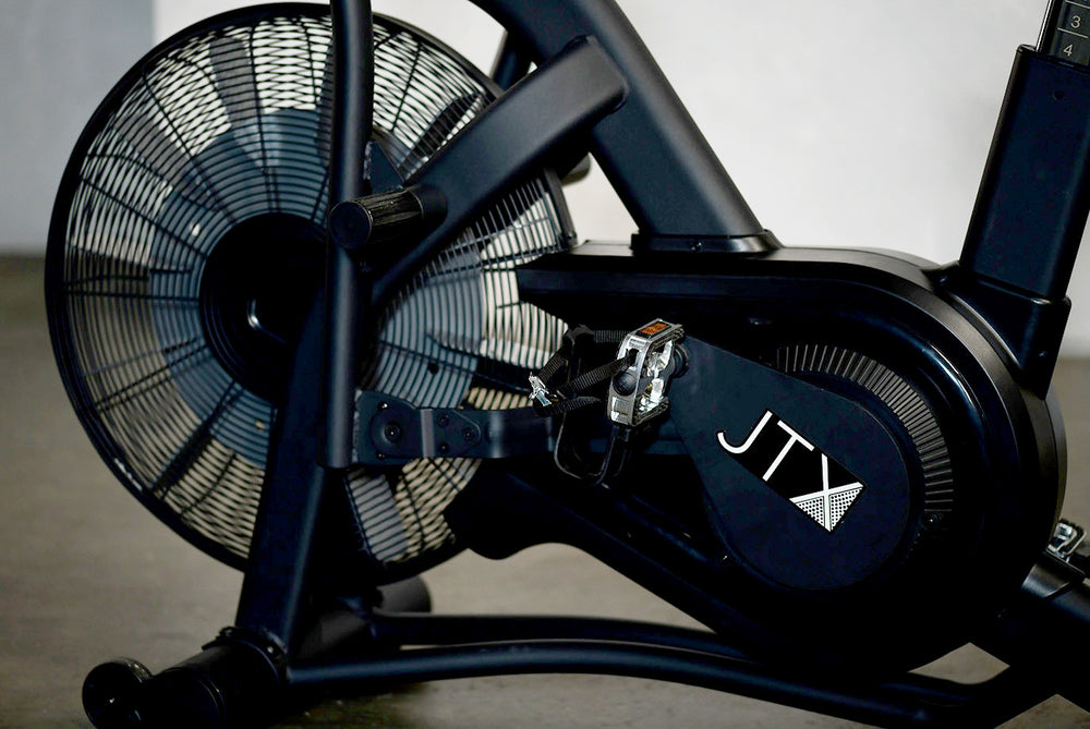 Front mounted fan wheel, pedals and crank of the JTX Mission Air bike.