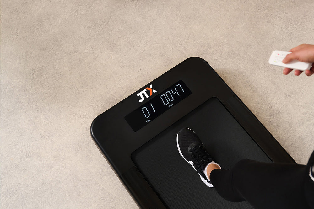 The digital display of the JTX Movelight walking pad. It shows the user's distance and number of steps.