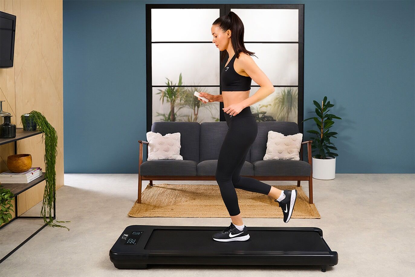 JTX Movelight Walking Pad Operating at Jogging Pace In a Living Room